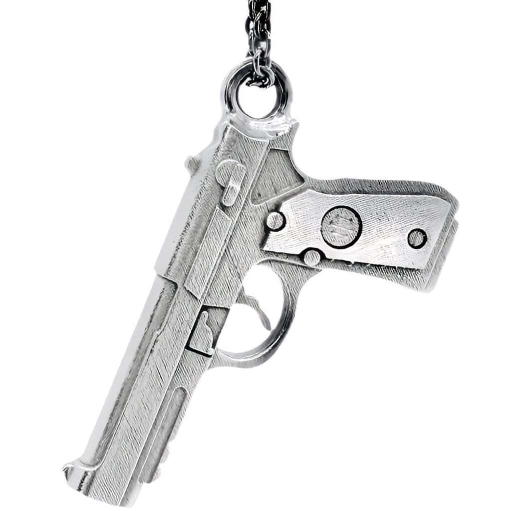 ciondolo pistola tipo beretta 9 mm in oro bianco 18kt con molti dettagli