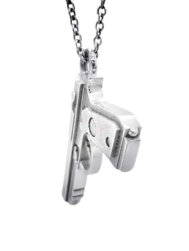 ciondolo a forma di beretta pistola 9mm oro bianco 18kt